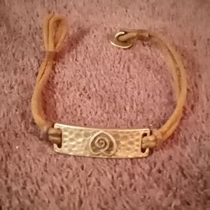 Leather bracelet w steel band w heart engraved in it